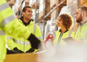 Warehouse workers discussing safety procedures