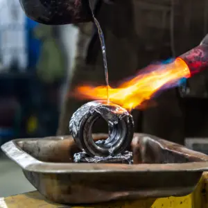 Metal part being heated with a torch